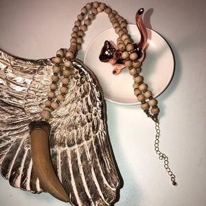 Adorable wooden beaded necklace with sabertooth